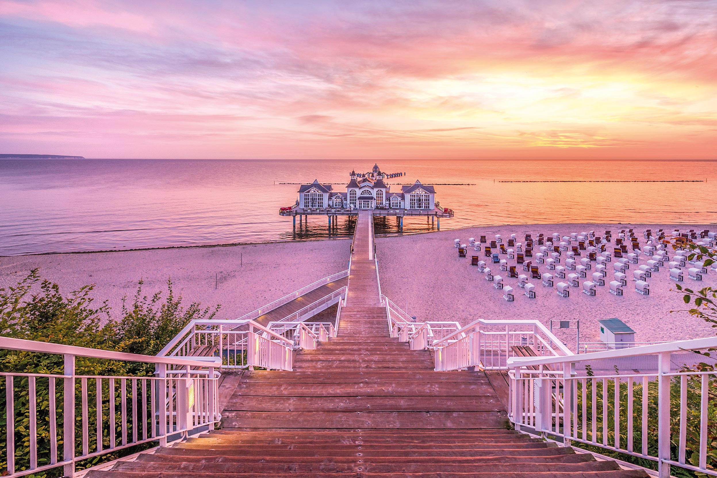 Seebrücke Sellin pier at sunrise over the calm Baltic Sea